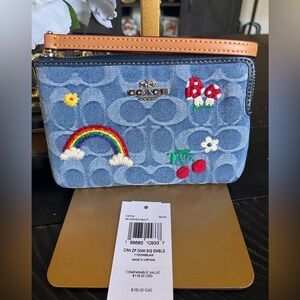 NWT Coach Corner Zip wristlet in signature denim with embroidery motif